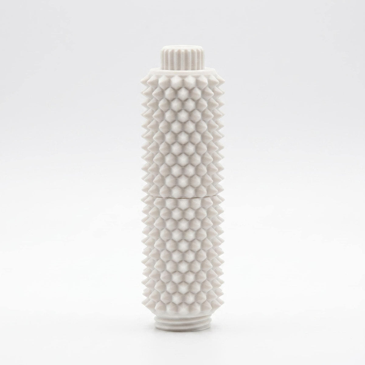 Weißer Spiky Clicker mit Drehknopf und tastbaren Stacheln.
