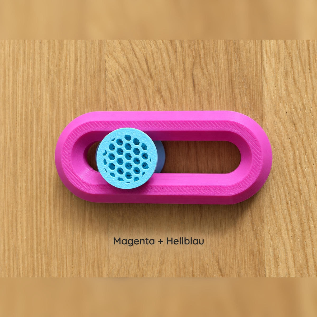 Magentafarbener Fidget Slider mit hellblauem Knubbel.