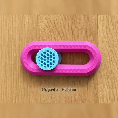 Magentafarbener Fidget Slider mit hellblauem Knubbel.